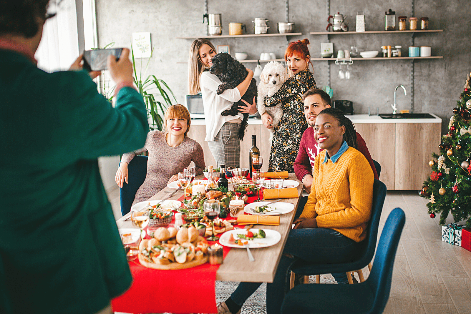 Image featuring people sitting around a festive table and openly discussing