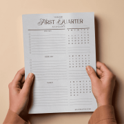 Printed 2026 quarterly planner pages laid out flat, showing clean and structured planning sections for Q1–Q4.